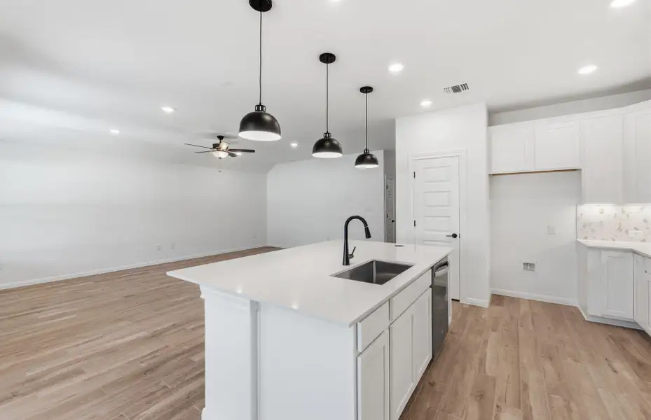Furnished interior view inside a new home in West Cypress Hills, Spicewood (Image 6).