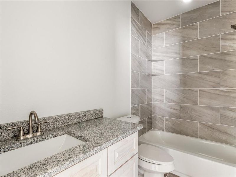 Bathroom featuring vanity and shower combination Bathroom featuring vanity and shower combination