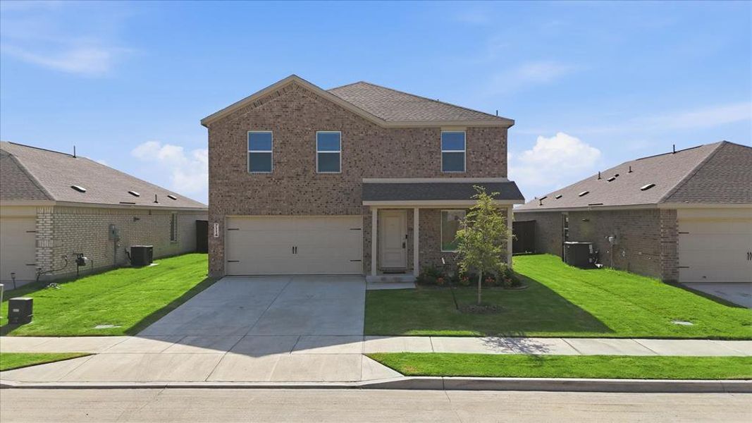 Front exterior of a new home in Mobberly Farms, Pilot Point, TX, highlighting curb appeal (Image 1). Front exterior of a new home in Mobberly Farms, Pilot Point, TX, highlighting curb appeal (Image 1).