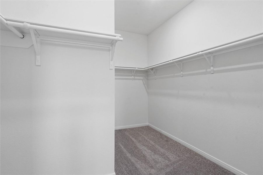 Experience the convenience of a spacious walk-in closet designed to simplify your morning routine. There is plenty of room to keep your wardrobe organized and easily accessible. Experience the convenience of a spacious walk-in closet designed to simplify your morning routine. There is plenty of room to keep your wardrobe organized and easily accessible.