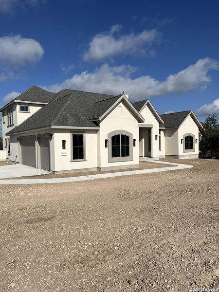 Front exterior of a new home in , Canyon Lake, TX, highlighting curb appeal (Image 22). Front exterior of a new home in , Canyon Lake, TX, highlighting curb appeal (Image 22).