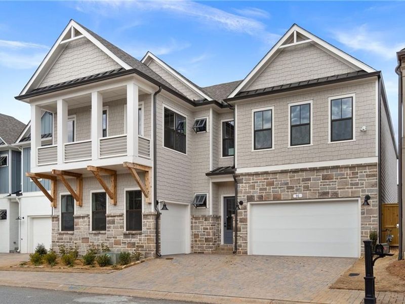 Exterior details and patio area of a home in The Village at Towne Lake, Woodstock (Image 1).