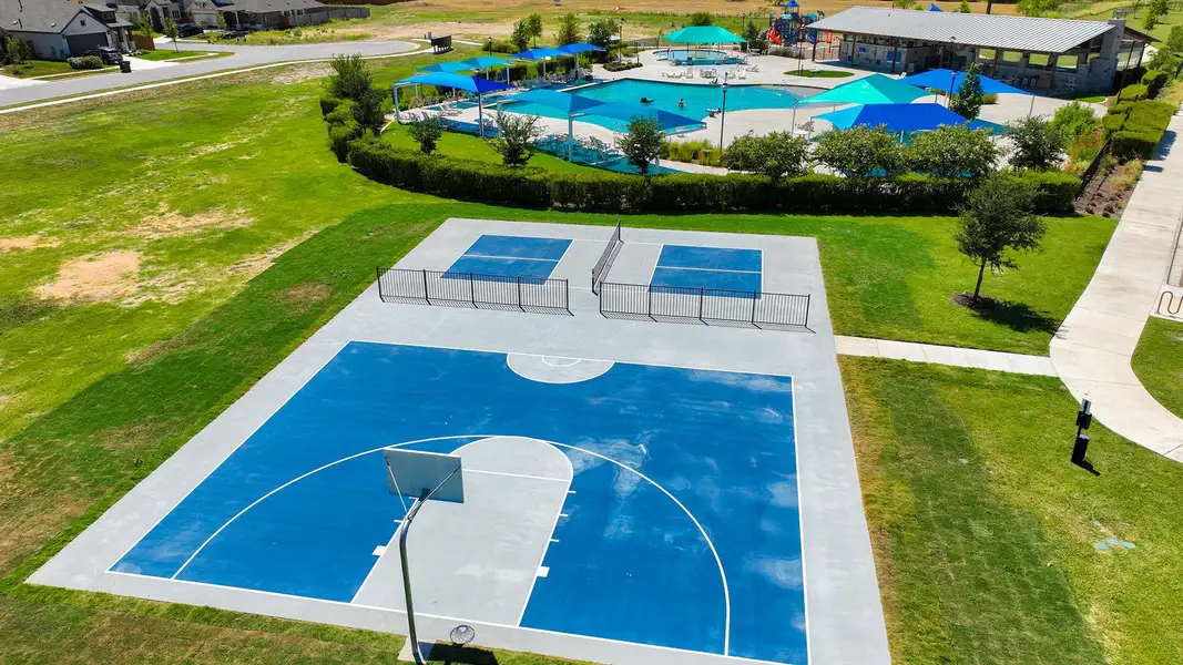 View of sport court with community basketball court and a patio