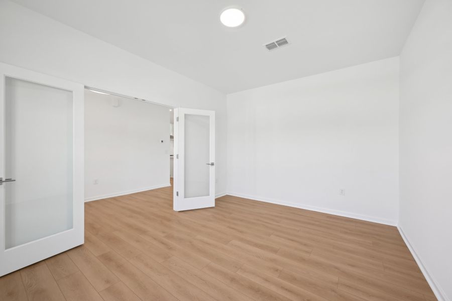 Representative unfurnished interior of a home built from the Jordan by Ashton Woods in Rowland's Grant, Fuquay Varina (Image 33).