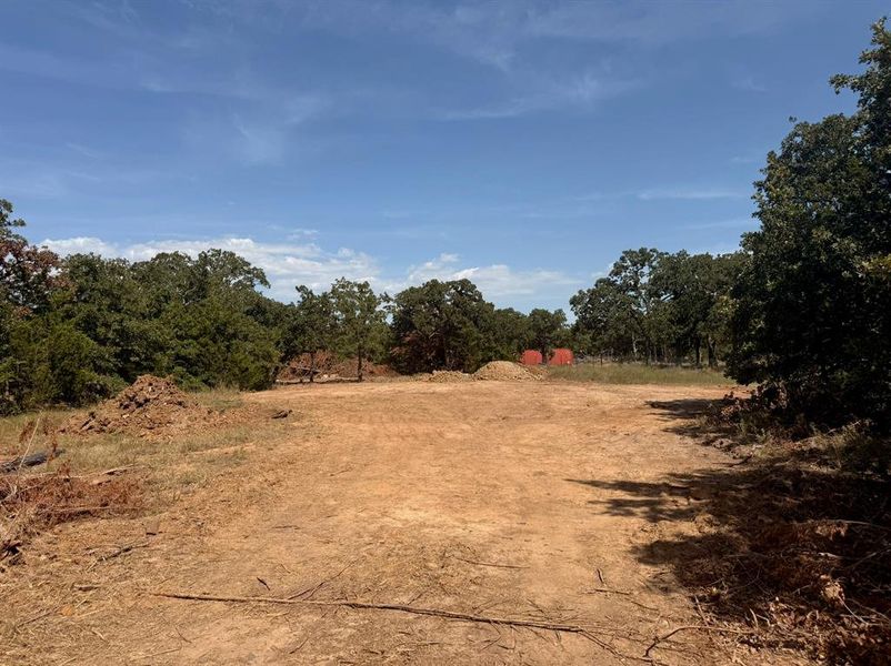 Home site surrounded by mature oak and cedar trees!