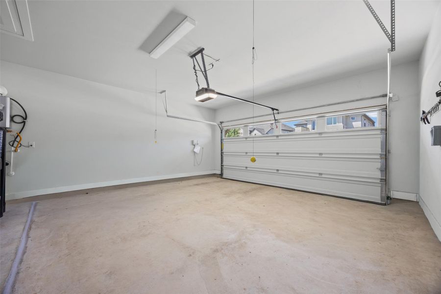 An immaculate garage offers abundant parking and additional storage solutions for your vehicles and belongings.