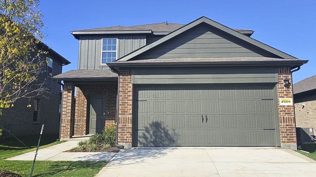 Representative exterior photo of a completed home built from the NICOLE by D.R. Horton in Northspur, Forney, TX (Image 1). Representative exterior photo of a completed home built from the NICOLE by D.R. Horton in Northspur, Forney, TX (Image 1).
