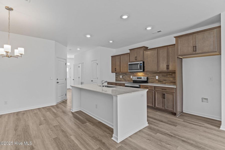 Furnished interior view inside a new home in Coastal Haven Townes, Leland (Image 8).