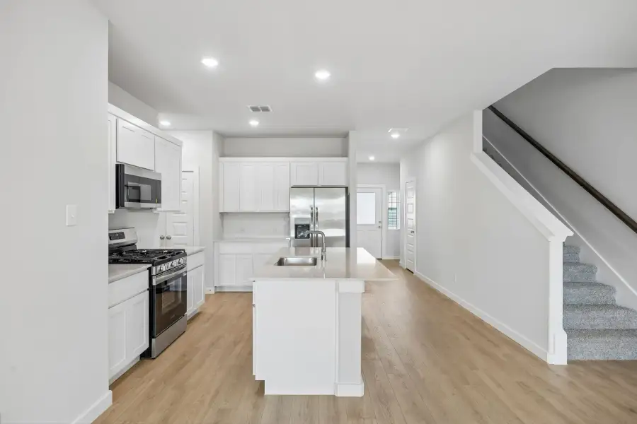 Kitchen in the Mesquite home plan by Trophy Signature Homes – REPRESENTATIVE PHOTO Kitchen in the Mesquite home plan by Trophy Signature Homes – REPRESENTATIVE PHOTO