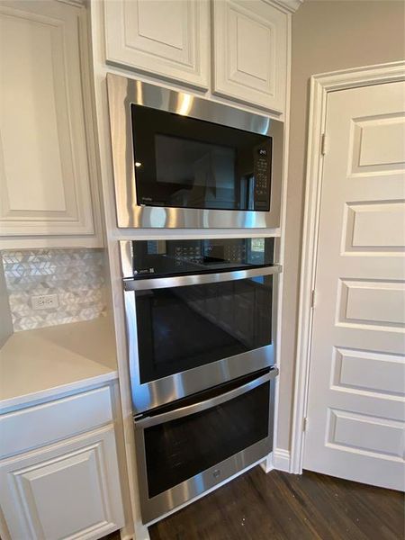 Built-in stainless GE Profile double oven with microwave above is perfect for large gatherings