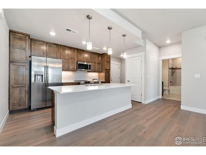 Furnished interior view inside a new home in The Lakes at Centerra - North Shore Flats, Loveland (Image 6).