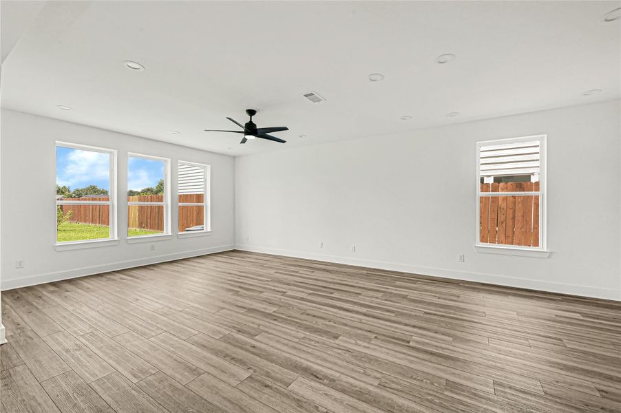 Spacious family room with soaring ceilings and abundant natural light. Spacious family room with soaring ceilings and abundant natural light.