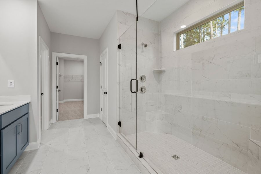 Expansive walk-in shower in primary bath