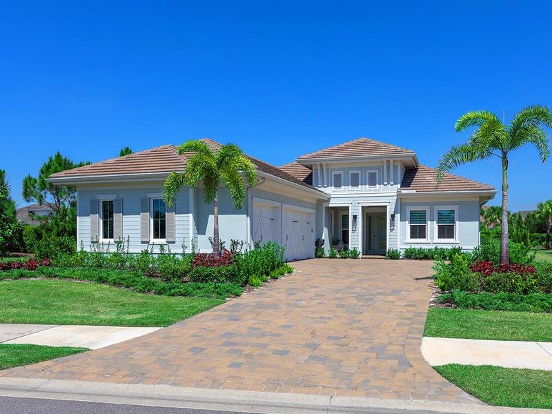 Front exterior of a new home in , Lakewood Ranch, FL, highlighting curb appeal (Image 21).