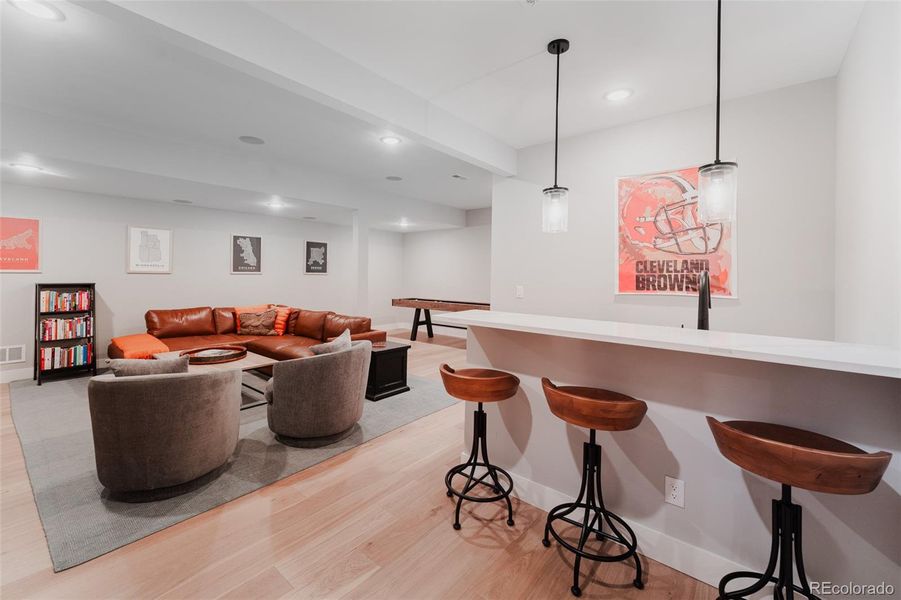 A tastefully finished wet bar adds an element of sophistication and convenience, perfect for showcasing your finest spirits and ensuring guests are always treated to expertly crafted refreshments.