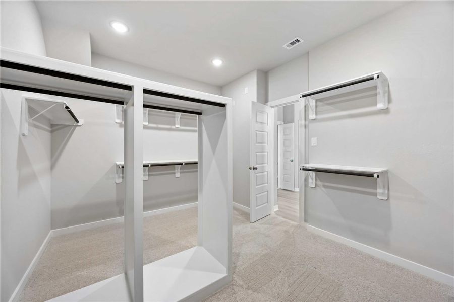 The luxurious owner's retreat is a private oasis with a spa-inspired bath and an extended walk-in closet.
