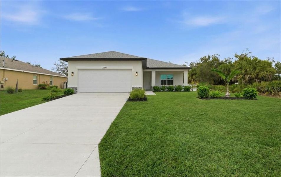 Front exterior of a new home in , North Port, FL, highlighting curb appeal (Image 27).