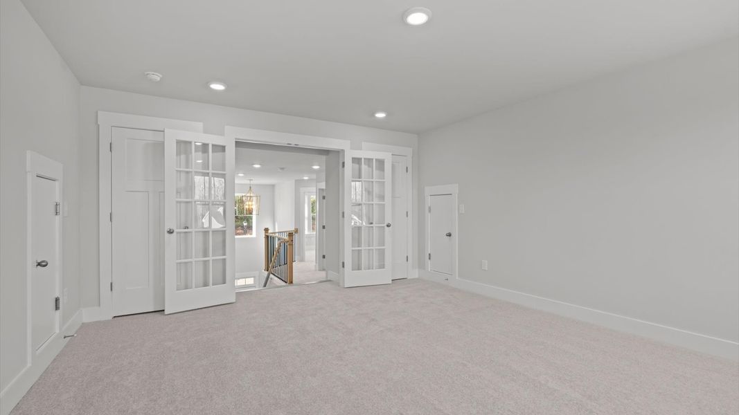 Notable carpeted bonus room designed with high standards and refined finishes