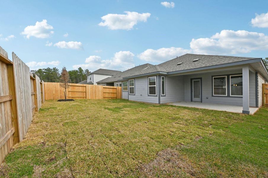 Exterior details and patio area of a home in , Conroe (Image 27).