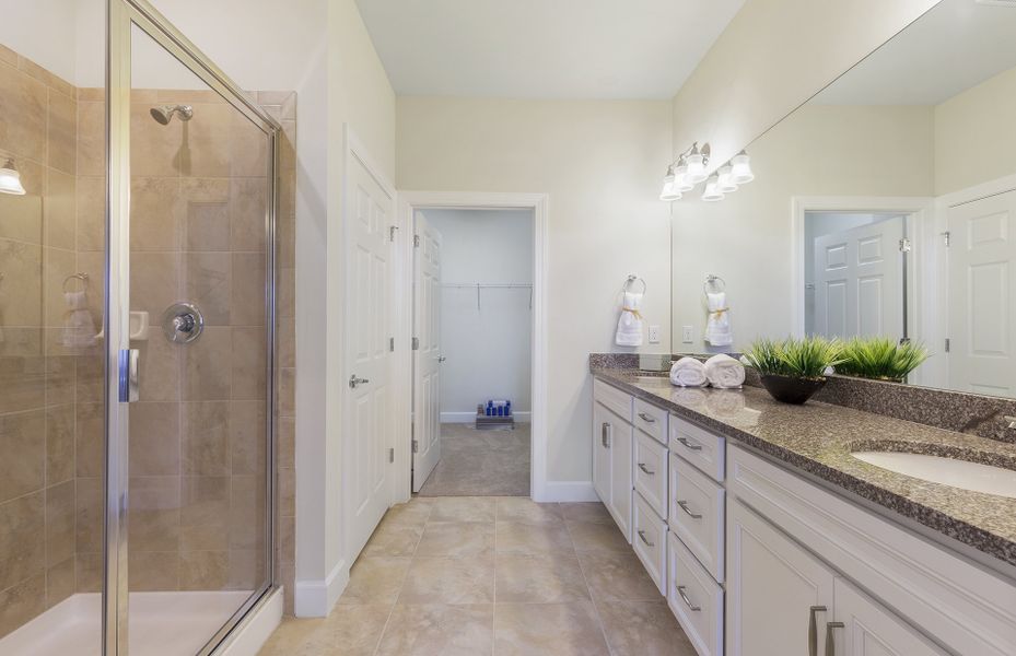 Owner's bath with tile floors and access to large walk-in closet