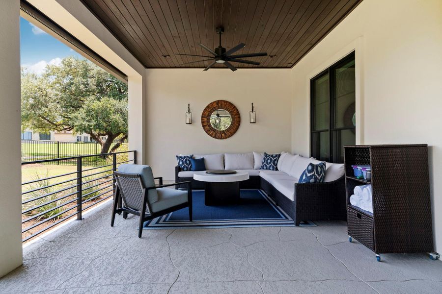 Outdoor covered patio with powered solar screen is ready for lounging! Outdoor covered patio with powered solar screen is ready for lounging!