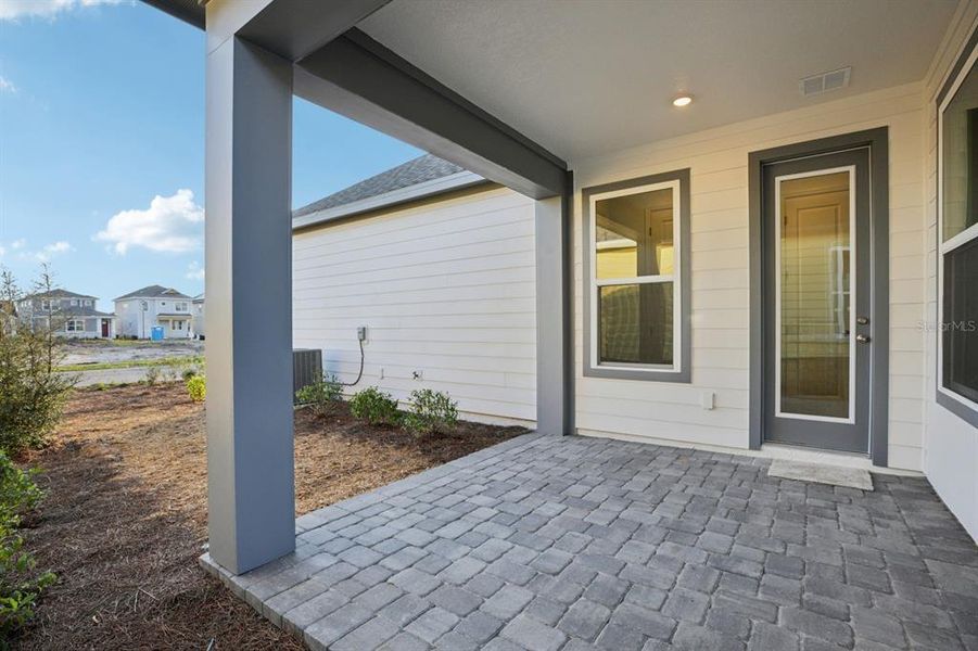 Exterior details and patio area of a home in Weslyn Park Single Family, St. Cloud (Image 13).