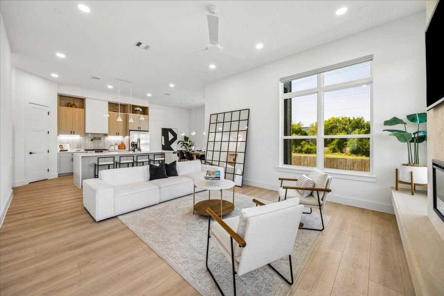 Expansive windows, soaring ceilings, and a clean, minimalist palette create a bright space designed for gathering.