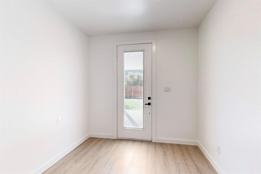 Entryway with light hardwood / wood-style floors