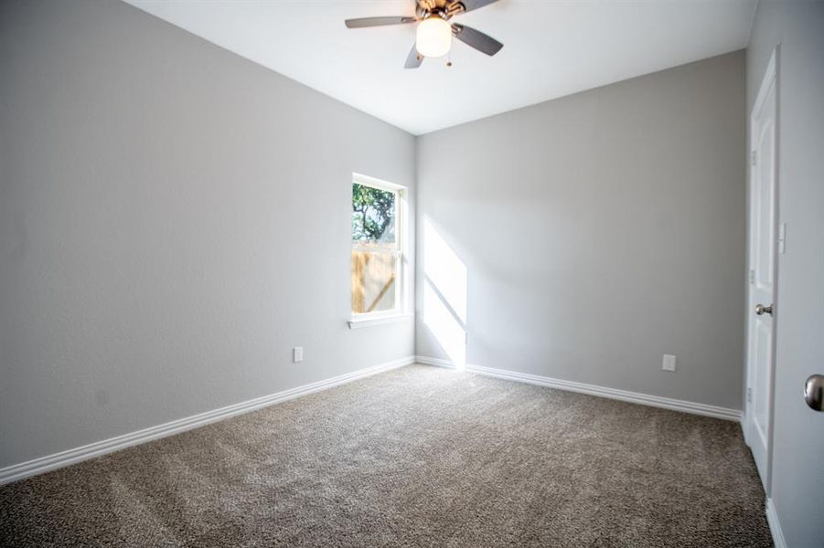 Unfurnished room with carpet flooring and ceiling fan