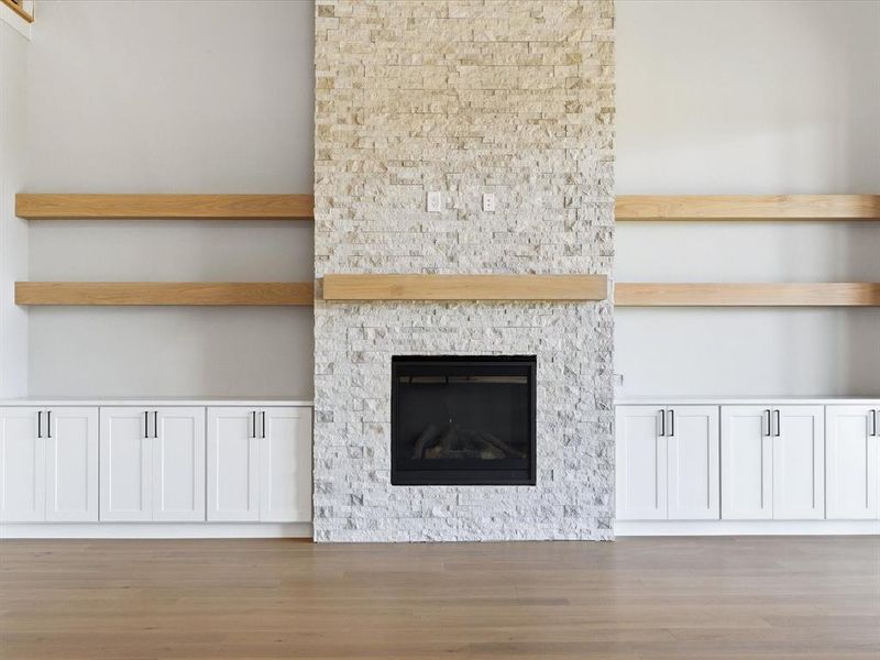 Unfurnished living room with a fireplace and light wood-style flooring