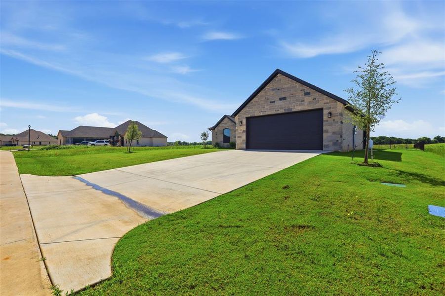 Front exterior of a new home in , Glen Rose, TX, highlighting curb appeal (Image 23). Front exterior of a new home in , Glen Rose, TX, highlighting curb appeal (Image 23).