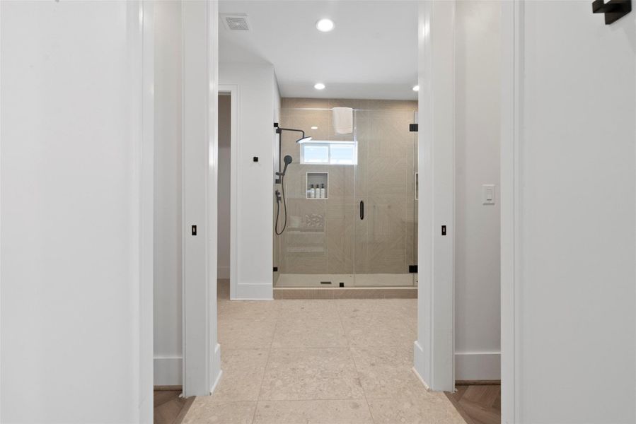 From the moment you step into this expansive primary bathroom, you're greeted by a thoughtfully designed layout that exudes modern sophistication. At the far end, an enclosed glass double shower makes a striking statement, while dual doorways lead to his-and-hers walk-in closets—offering generous storage and a seamless connection to the suite’s luxurious flow. From the moment you step into this expansive primary bathroom, you're greeted by a thoughtfully designed layout that exudes modern sophistication. At the far end, an enclosed glass double shower makes a striking statement, while dual doorways lead to his-and-hers walk-in closets—offering generous storage and a seamless connection to the suite’s luxurious flow.
