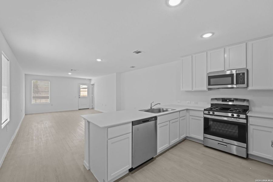 Furnished interior view inside a new home in Valle Sol, San Antonio (Image 6).