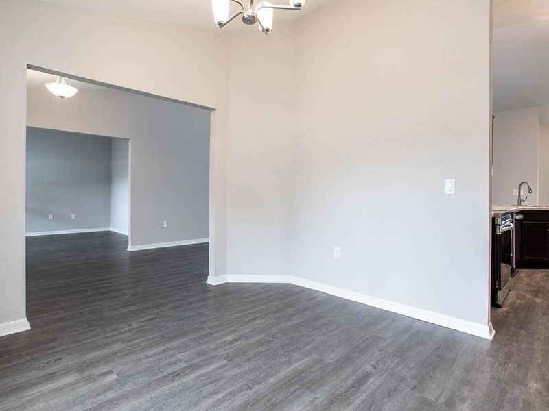 A formal dining room is located off the other end of the kitchen - New home for sale in Winter Haven, FL