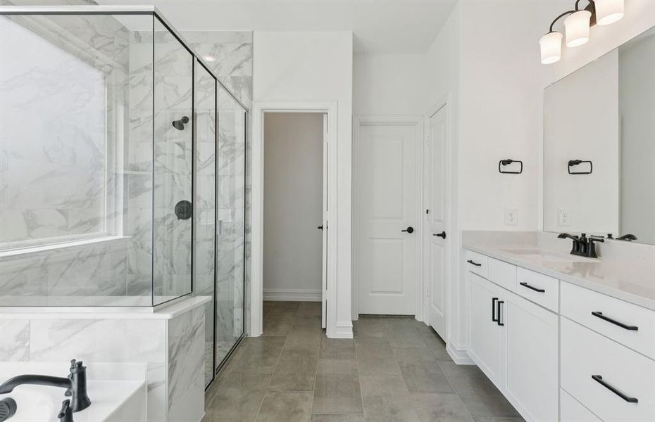 Luxurious owner's bath complete with double sinks and a generous shower Luxurious owner's bath complete with double sinks and a generous shower