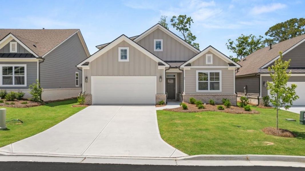 Front exterior of a new home in Hamptons at Riverwood North, Dallas, GA, highlighting curb appeal (Image 20).