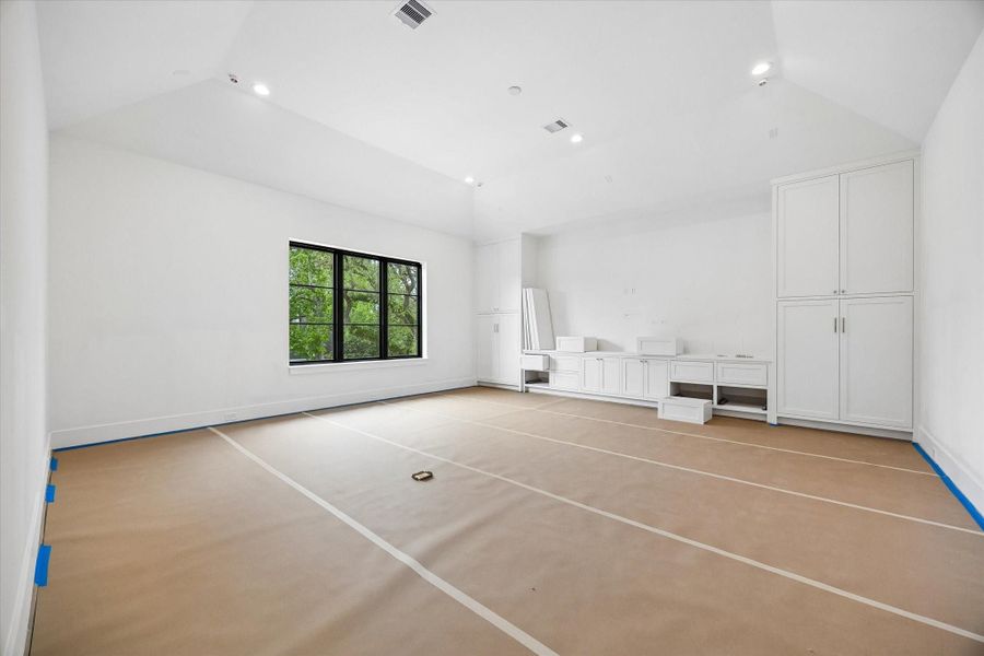 Spacious game room with custom cabinetry. Pictured April 2026.