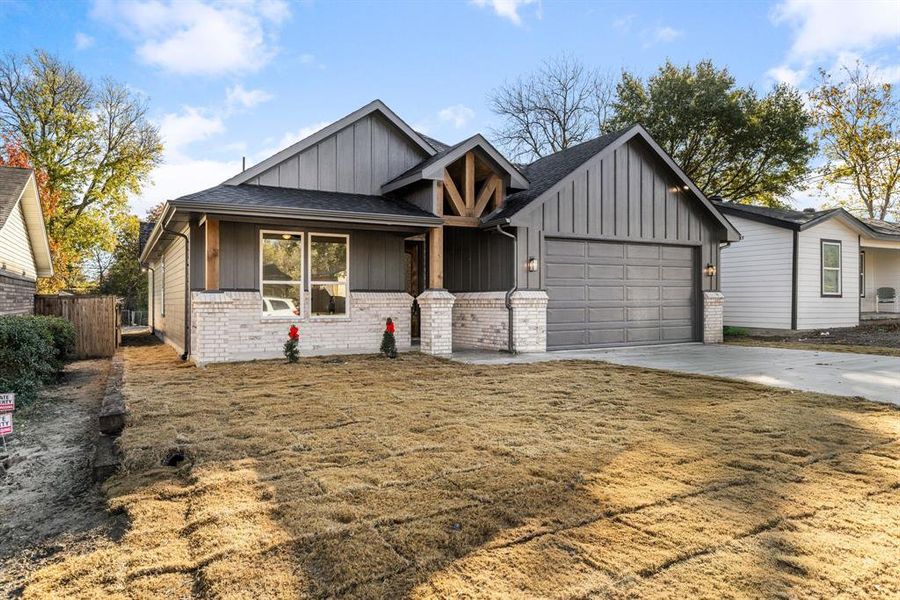 View of front facade featuring a garage