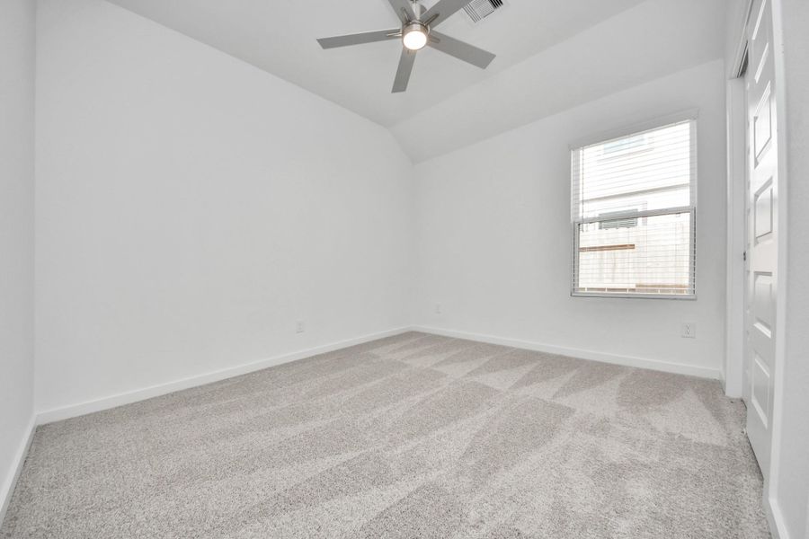 Secondary bedroom features plush carpeting, large windows that let in plenty of natural light, bright paint, and spacious closets. Secondary bedroom features plush carpeting, large windows that let in plenty of natural light, bright paint, and spacious closets.