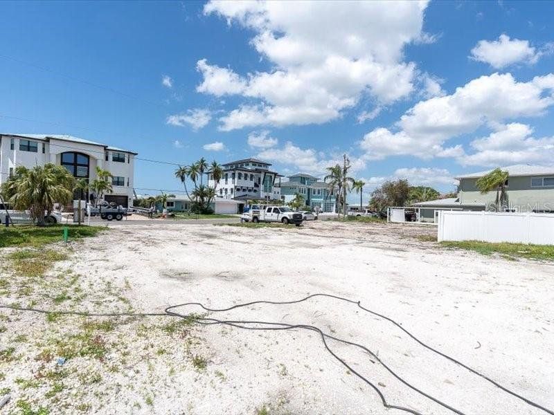 Front exterior of a new home in , Madeira Beach, FL, highlighting curb appeal (Image 9).