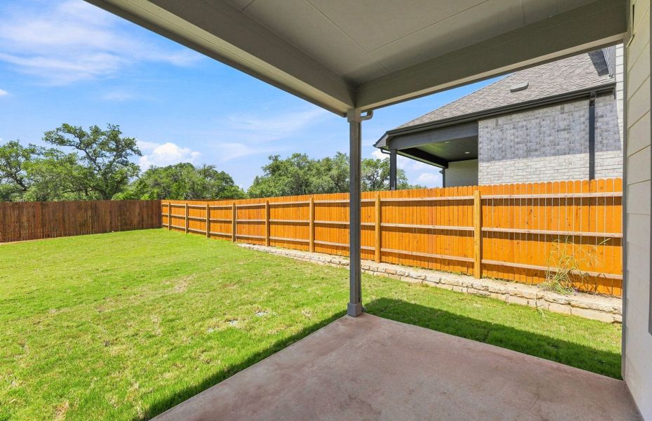 Exterior details and patio area of a home in Saddleback at Santa Rita Ranch, Liberty Hill (Image 24).
