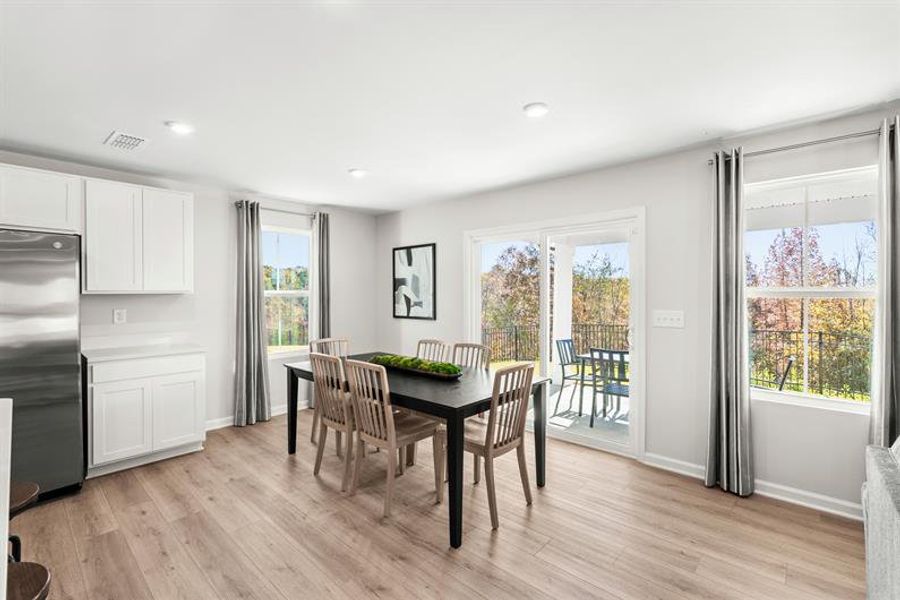 Representative furnished interior of a home built from the Woodford by Ryan Homes in Oakwood Trace, Fairburn (Image 12).