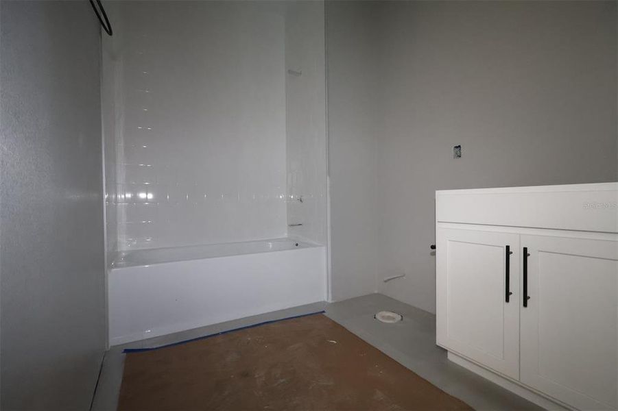 In-progress construction of a new home in Center Lake on the Park, St. Cloud, FL (Image 13).