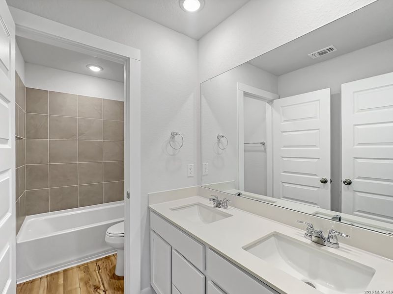Furnished interior view inside a new home in Bear Creek, San Antonio (Image 9).
