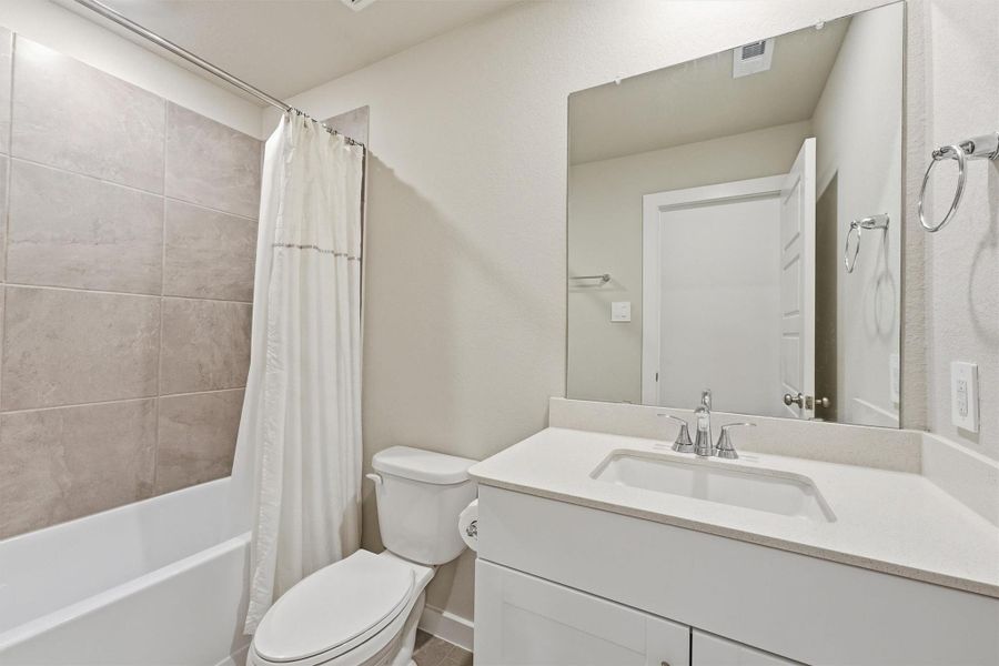 Secondary Bathroom has a combo Tub shower for a nice soak. Still looks like the model home Secondary Bathroom has a combo Tub shower for a nice soak. Still looks like the model home