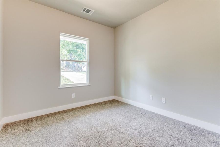 Empty room featuring carpet flooring