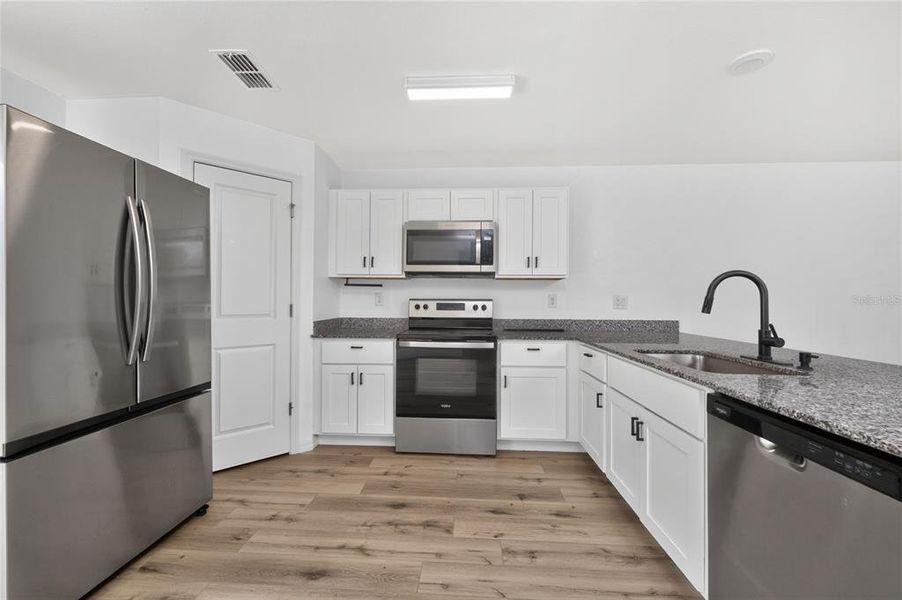 Furnished interior view inside a new home in , Port Charlotte (Image 7).