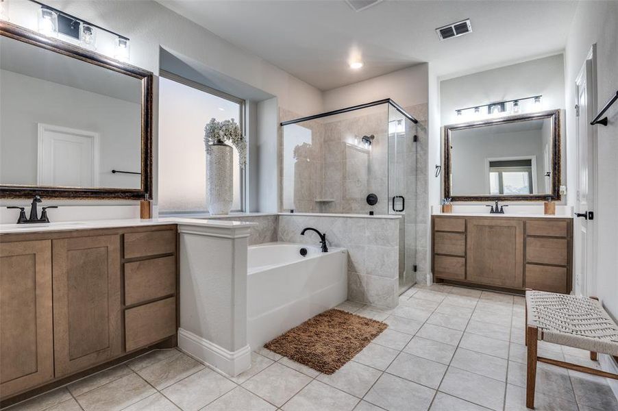 Bathroom featuring a shower stall, a bath, tile patterned floors, and vanity Bathroom featuring a shower stall, a bath, tile patterned floors, and vanity