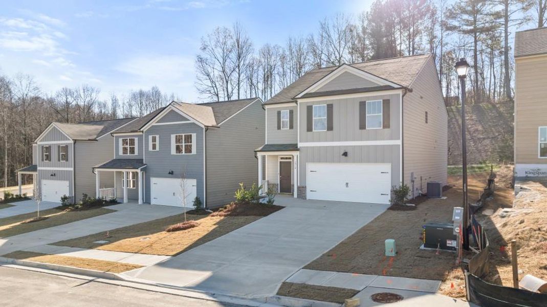 Front exterior of a new home in Oconee Overlook, Gainesville, GA, highlighting curb appeal (Image 21). Front exterior of a new home in Oconee Overlook, Gainesville, GA, highlighting curb appeal (Image 21).