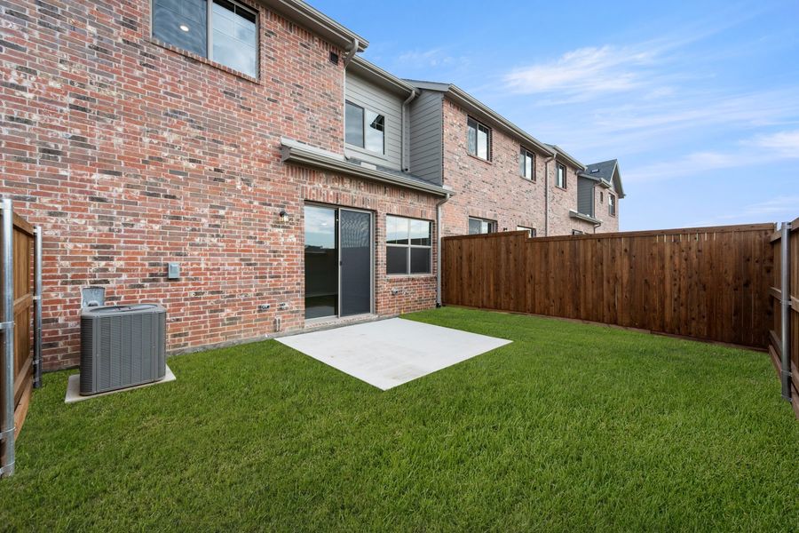 Exterior details and patio area of a home in Wildridge, Oak Point (Image 4).
